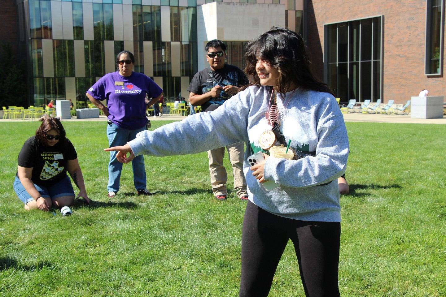 2024 SLTer, Bri, leads a "Riff Off" on the EMU green.