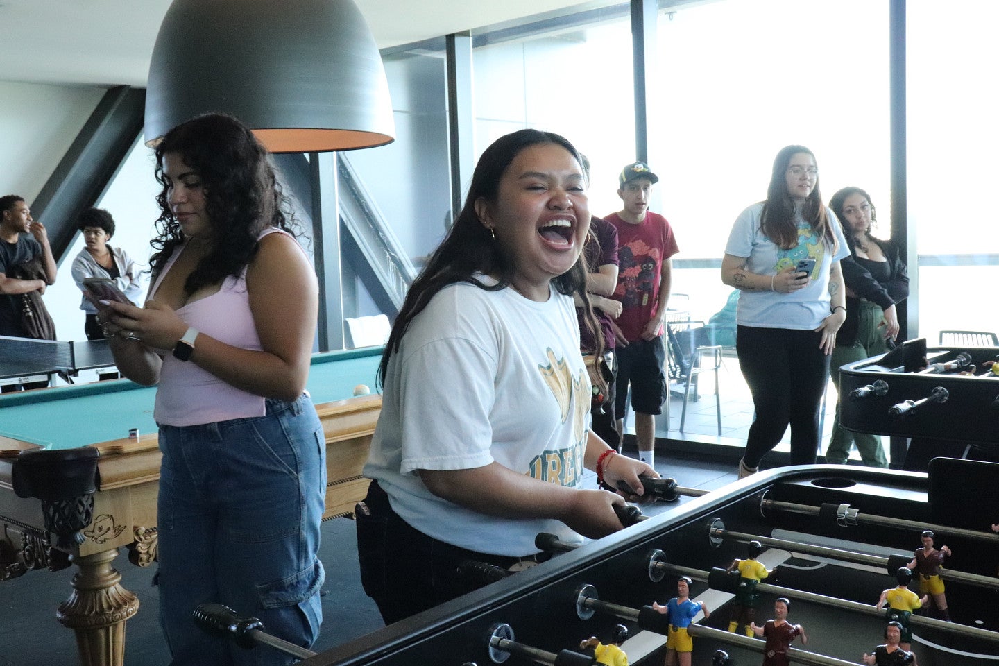 a NSFR Student plays foosball