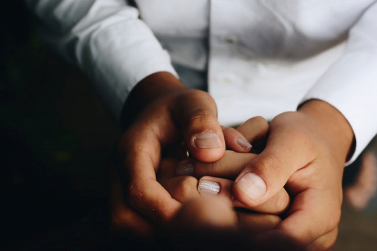 People holding each other's hands.