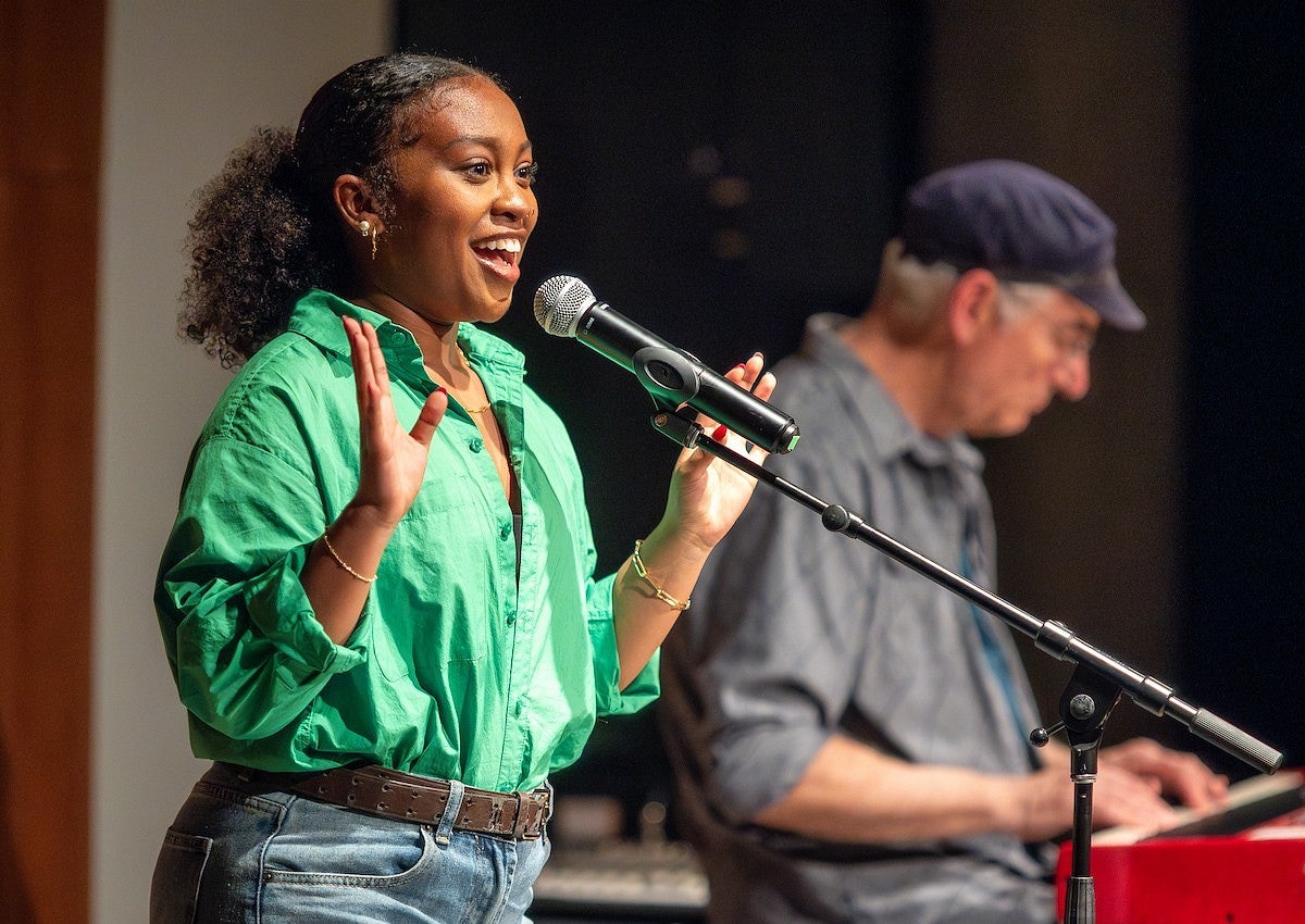 Women speaking into the mic.
