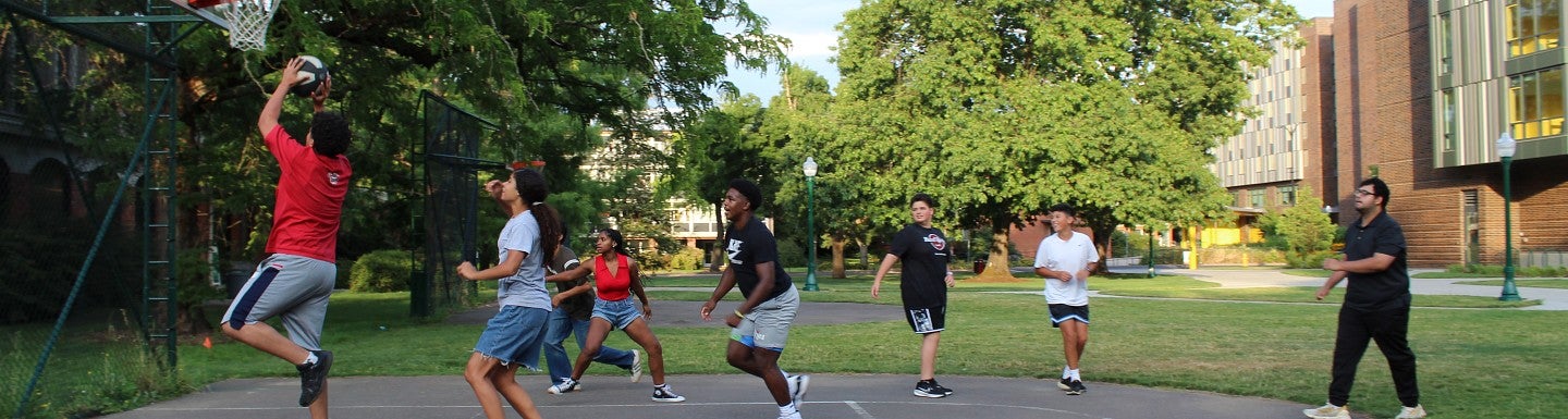 Students playing basketball during activity time