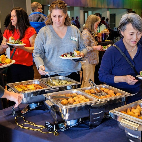 People serving themselves food