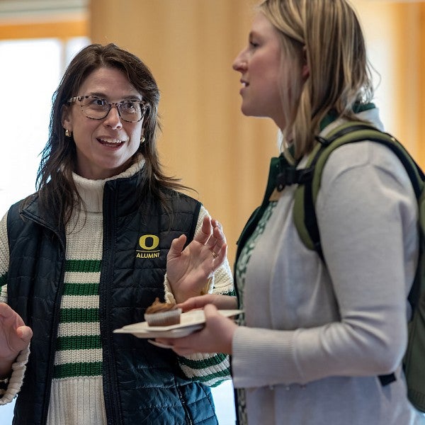 Women having conversation at amplifying workshop.
