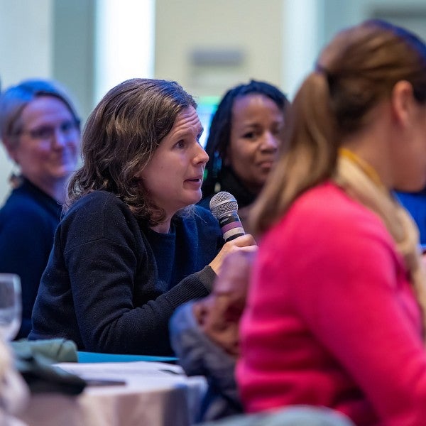 Woman speaking into the microphone