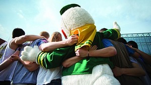 The duck in a huddle with students