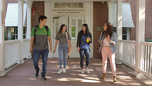 four students walking 