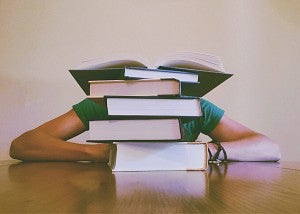 student behind textbooks