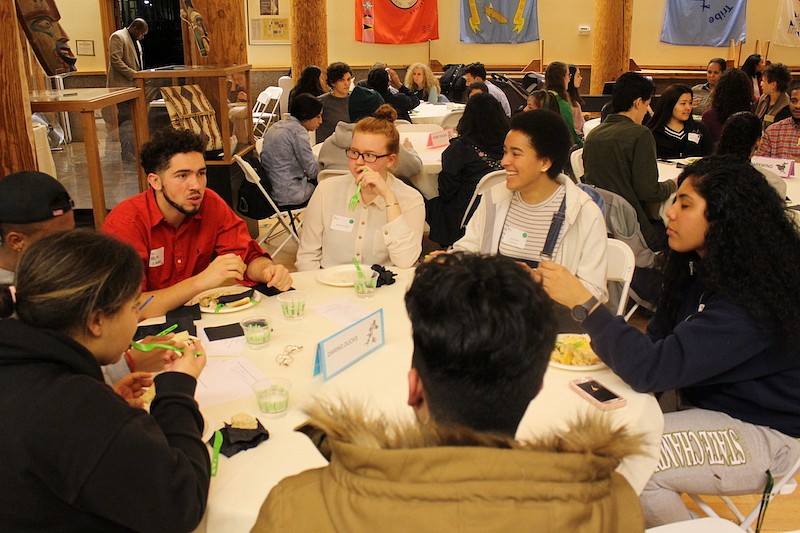 CMAE Winter Retreat Students talking at table