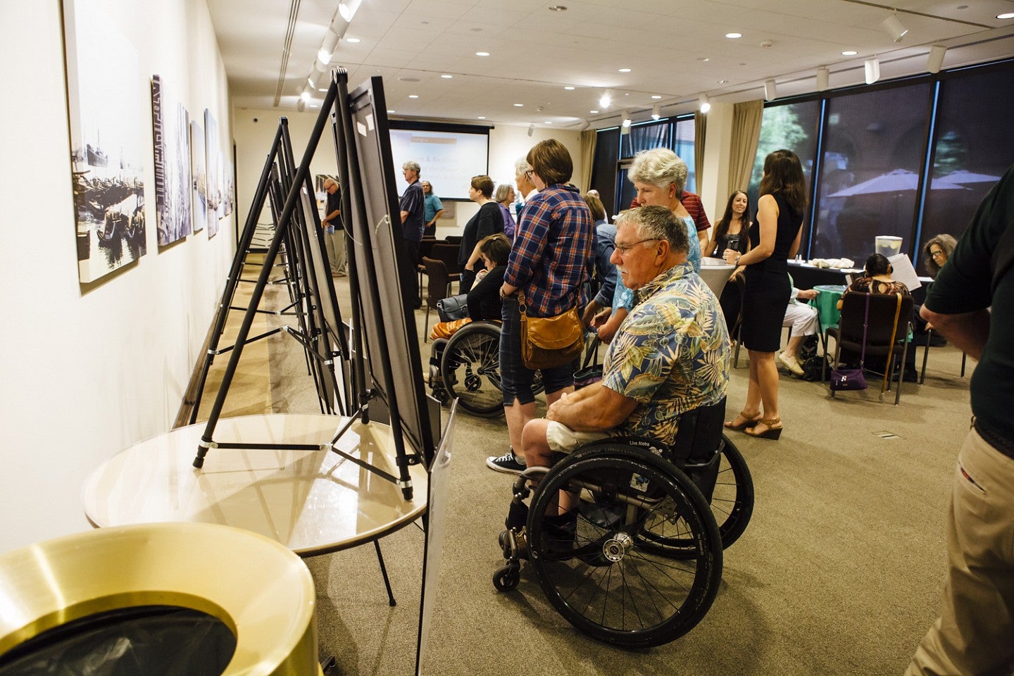 Brilliant MIUSA JSMA Lace Page accessibility Brilliant Resilian Art Exhibit. People standing and using whellechairs to look at exhibit.