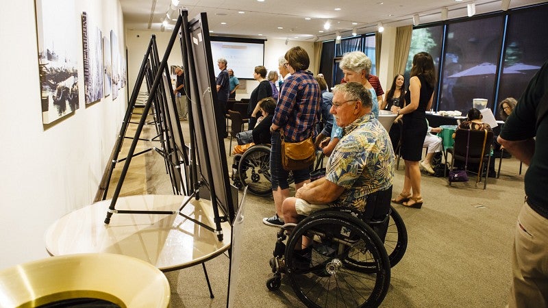 Brilliant MIUSA JSMA Lace Page accessibility Brilliant Resilian Art Exhibit. People standing and using whellechairs to look at exhibit.