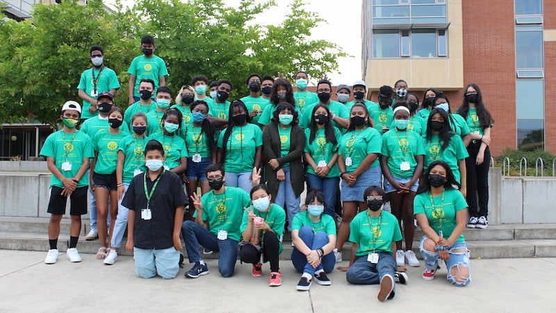 Oregon Young Scholars Program OYSP 2021 Oregon Young Scholars program students standing outside in a group with green t-shirts