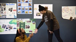 New Student Fall Retreat 2019 lace photo Two students doing improv going to hold each other's hands
