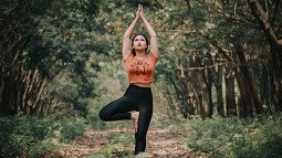 wellness lace pages yoga woman doing yoga in the woods