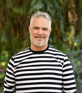 Image of Prof. Mat Johnson wearing a striped shirt